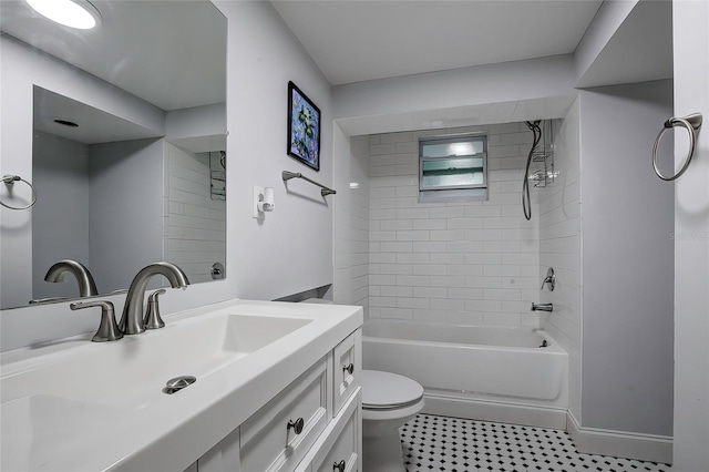 full bathroom with vanity, tiled shower / bath, and toilet