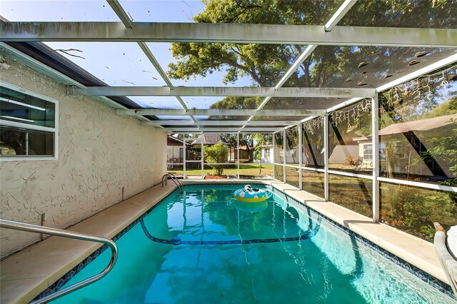 view of pool featuring a lanai