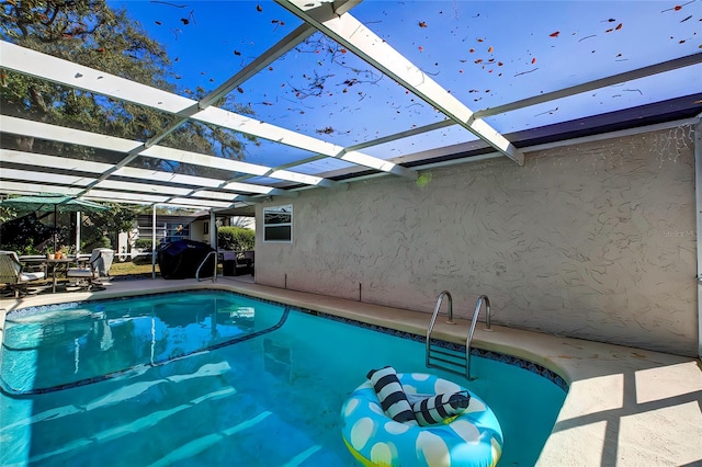 view of pool featuring a lanai and a patio area