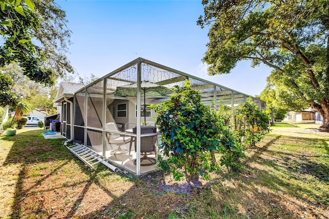 view of outdoor structure with a lawn