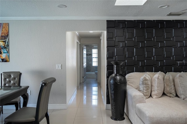 hall with crown molding, a textured ceiling, light tile patterned flooring, and a wealth of natural light