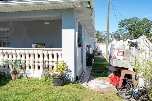 view of property exterior with a lawn