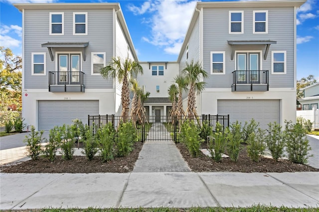 view of front of home featuring a balcony and a garage