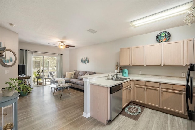 kitchen with dishwasher, light brown cabinets, kitchen peninsula, sink, and light wood-type flooring