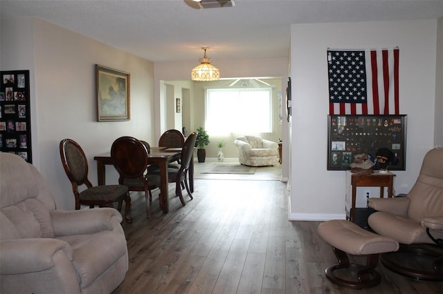 4460 95th Ave N Unit 1, Pinellas Park, FL 33782 - living room with baseboards and wood-type flooring