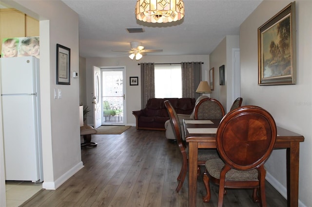 4460 95th Ave N Unit 1, Pinellas Park, FL 33782 - dining area with ceiling fan, baseboards, hardwood / wood-style floors, and visible vents