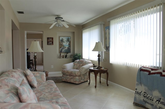 tiled living room with ceiling fan