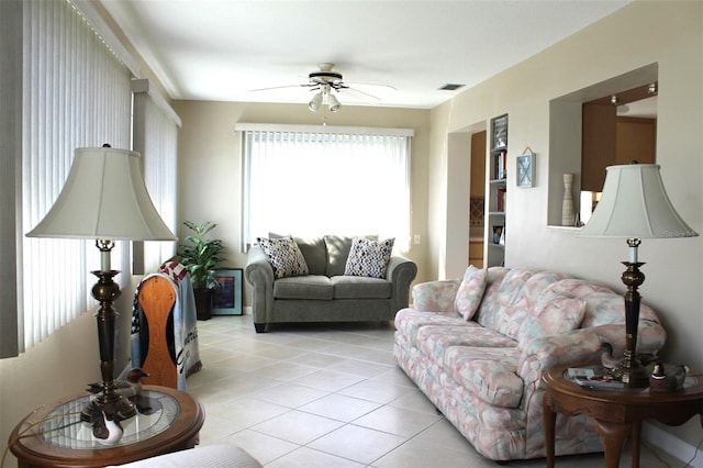 living room featuring ceiling fan and light tile patterned floors