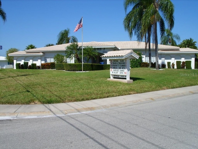 4460 95th Ave N Unit 1, Pinellas Park, FL 33782 - ranch-style house with stucco siding, a tiled roof, and a front yard