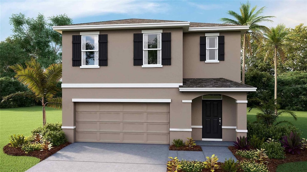 view of front facade featuring a front lawn and a garage