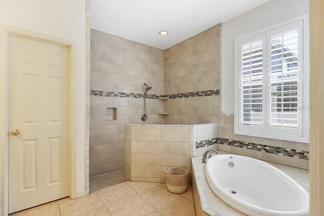 bathroom featuring tile walls, tile patterned floors, and separate shower and tub