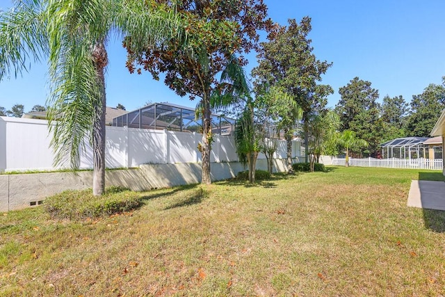 view of yard featuring a lanai