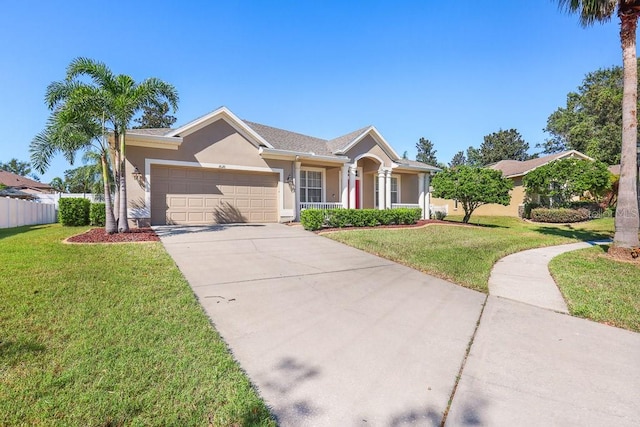 ranch-style home with a front yard and a garage