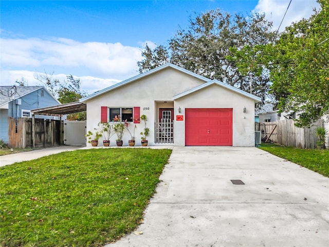 ranch-style house with a carport, a front yard, and a garage