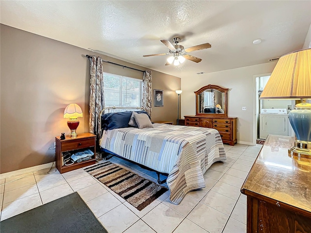 tiled bedroom featuring ceiling fan and a textured ceiling