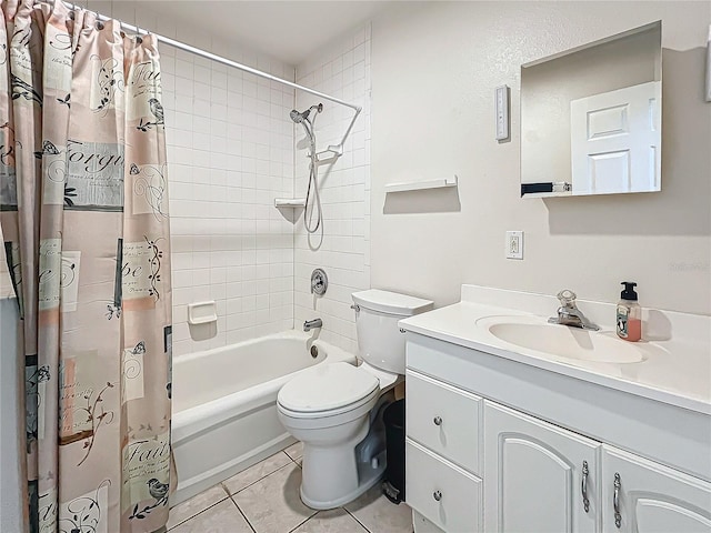 full bathroom with vanity, toilet, tile patterned floors, and shower / tub combo