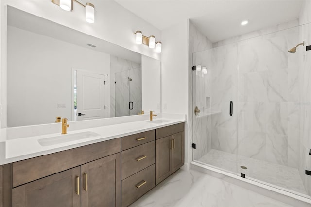 bathroom featuring vanity and an enclosed shower