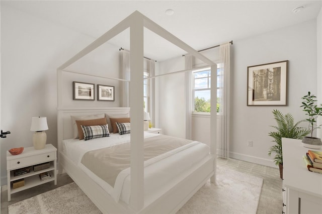 bedroom featuring light colored carpet