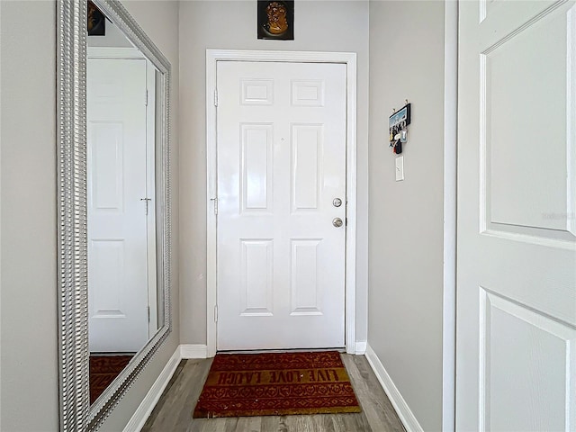 doorway with dark hardwood / wood-style floors