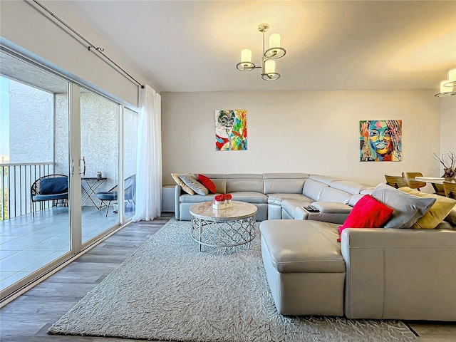 living room featuring a chandelier and dark hardwood / wood-style floors