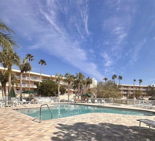 view of swimming pool featuring a patio area