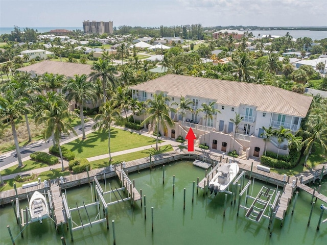 birds eye view of property with a water view