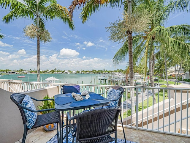 balcony featuring a water view