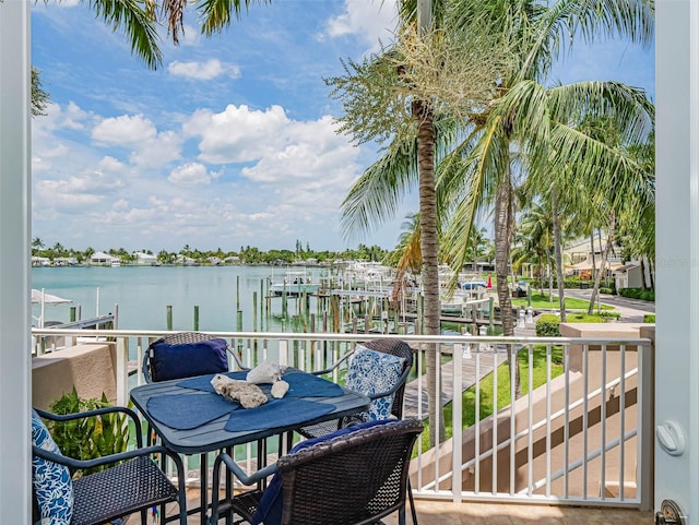 balcony featuring a water view