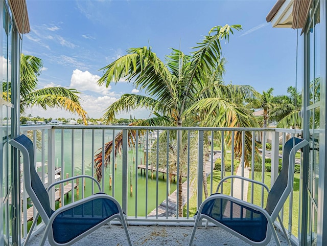 balcony featuring a water view