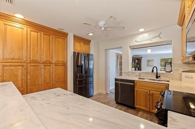 kitchen with ceiling fan, backsplash, sink, stainless steel appliances, and dark hardwood / wood-style flooring