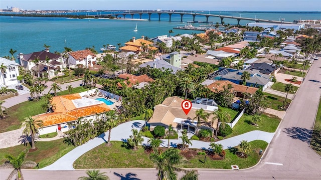 bird's eye view featuring a water view and a residential view