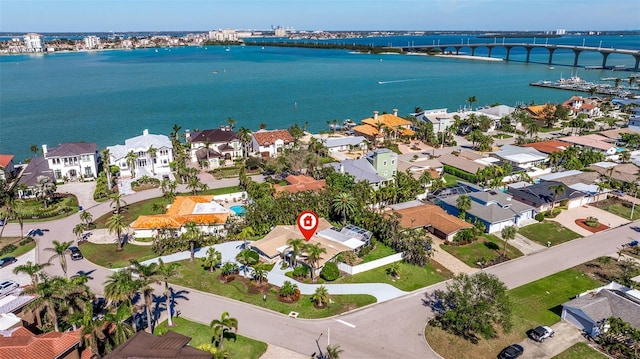 bird's eye view featuring a water view and a residential view