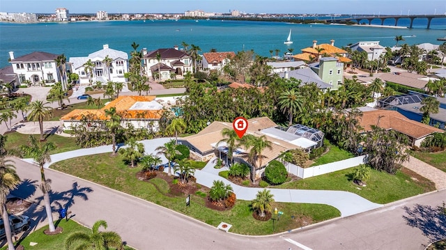 bird's eye view with a water view and a residential view