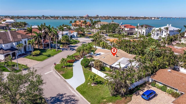 birds eye view of property featuring a water view and a residential view