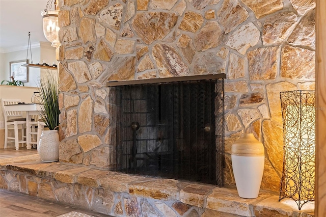 room details with ornamental molding and a fireplace