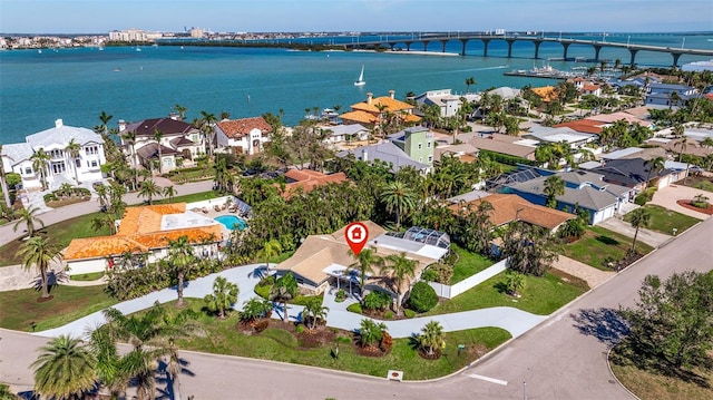 bird's eye view with a water view and a residential view