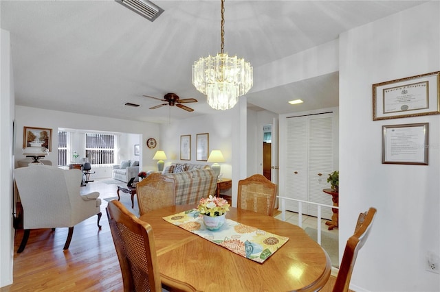 dining room with light wood-type flooring and ceiling fan