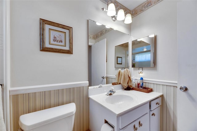 bathroom featuring toilet and vanity