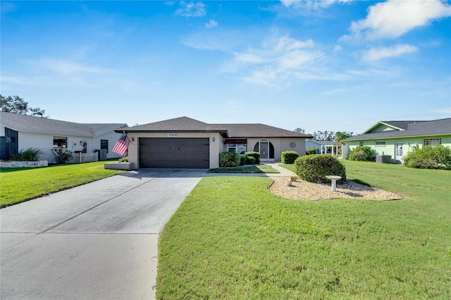 single story home featuring a front lawn and a garage