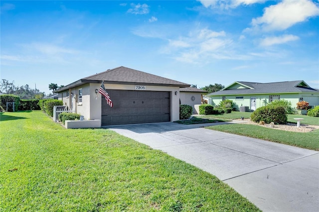 view of front facade featuring a front lawn and a garage