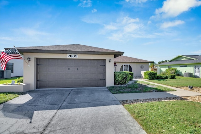 single story home with a front lawn, central AC, and a garage