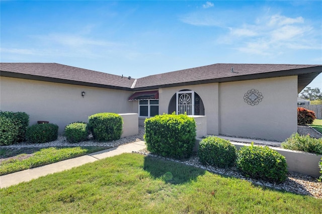 ranch-style house with a front yard