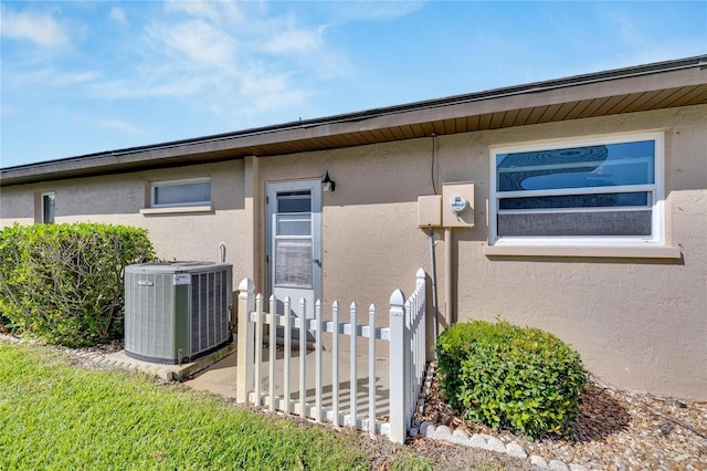 doorway to property with central air condition unit