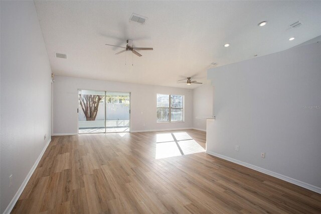 spare room with light wood-type flooring and ceiling fan