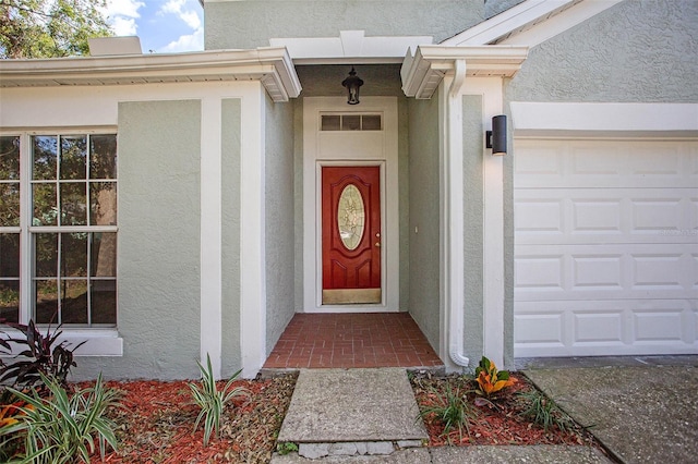 doorway to property featuring a garage