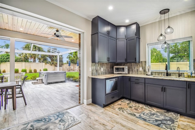 kitchen featuring light hardwood / wood-style flooring, decorative backsplash, sink, and crown molding