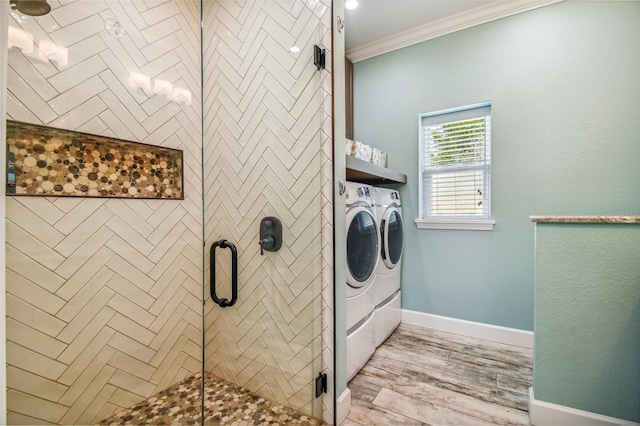 washroom with light hardwood / wood-style flooring, independent washer and dryer, and crown molding