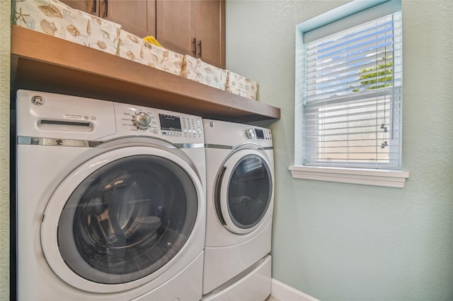 laundry area with washing machine and clothes dryer