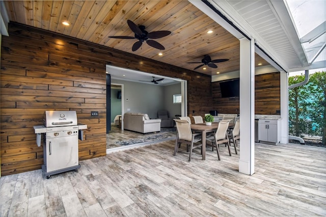 exterior space with a grill and ceiling fan