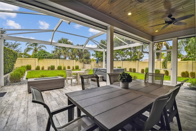 exterior space featuring ceiling fan and wood ceiling